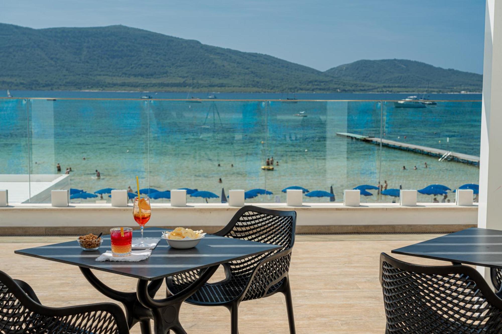 Hotel Portoconte Porto Conte Bagian luar foto